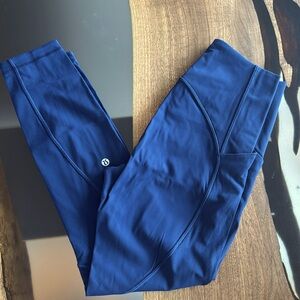 Navy blue women’s lululemon leggings. Size 6. Mesh cut-out detail on legs.